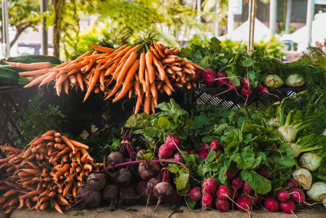An array of fresh vegatables on a market stand